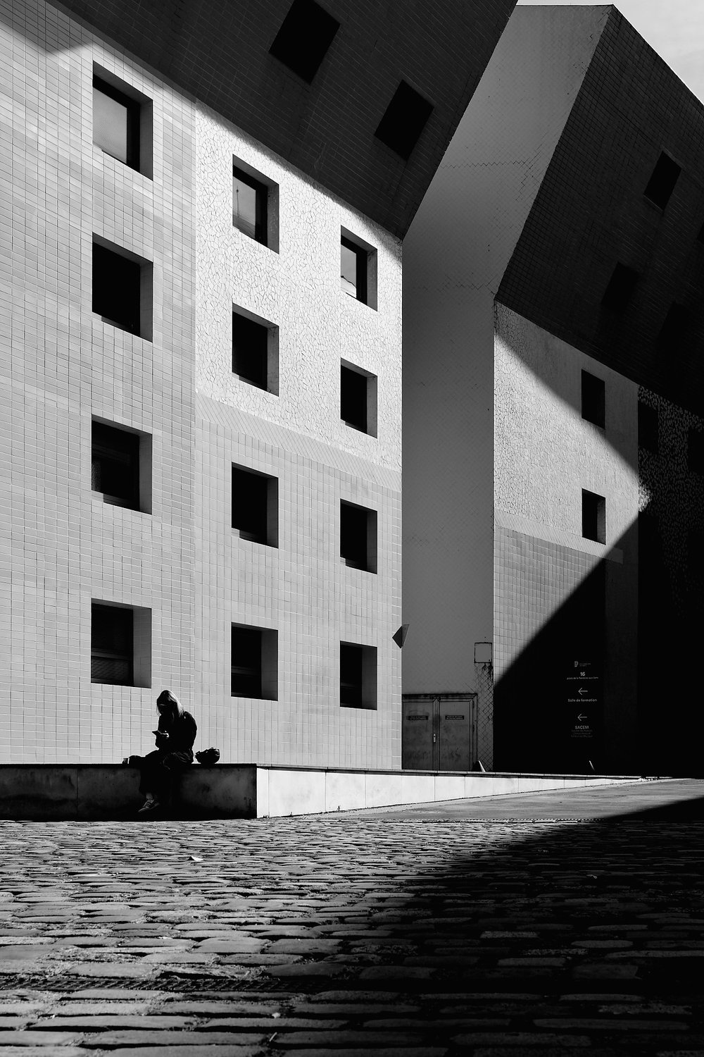 Seated figure and facade — Human Presence in Geometry